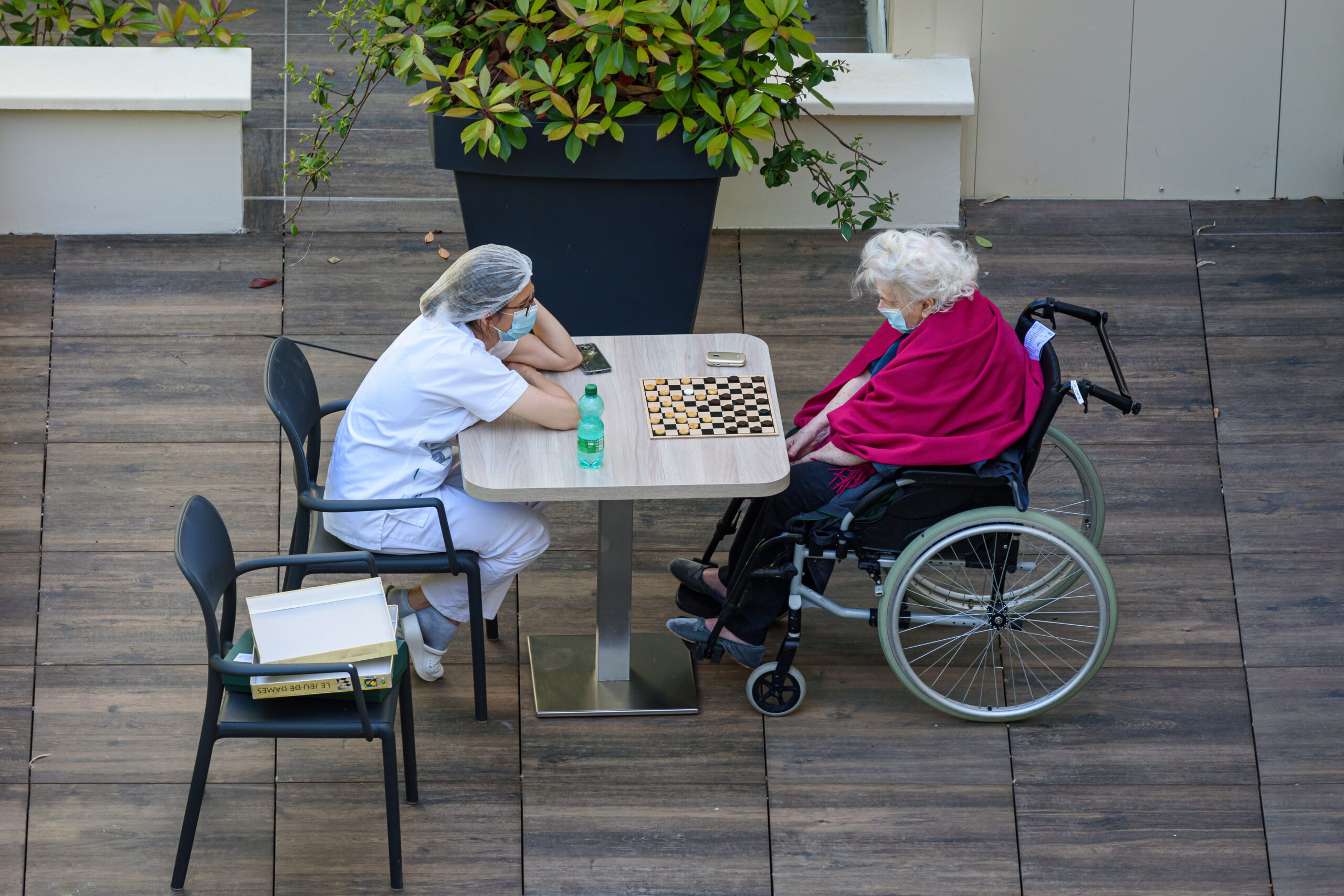Paris,,France,-,May,20,,2020:,Nurse,Playing,Checkers,With